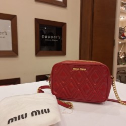 Miu Miu Matelassé or Madras crossbody bag in red leather