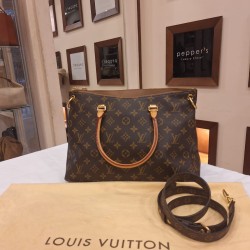 Louis Vuitton Pallas MM combines the House's iconic Monogram canvas with leather